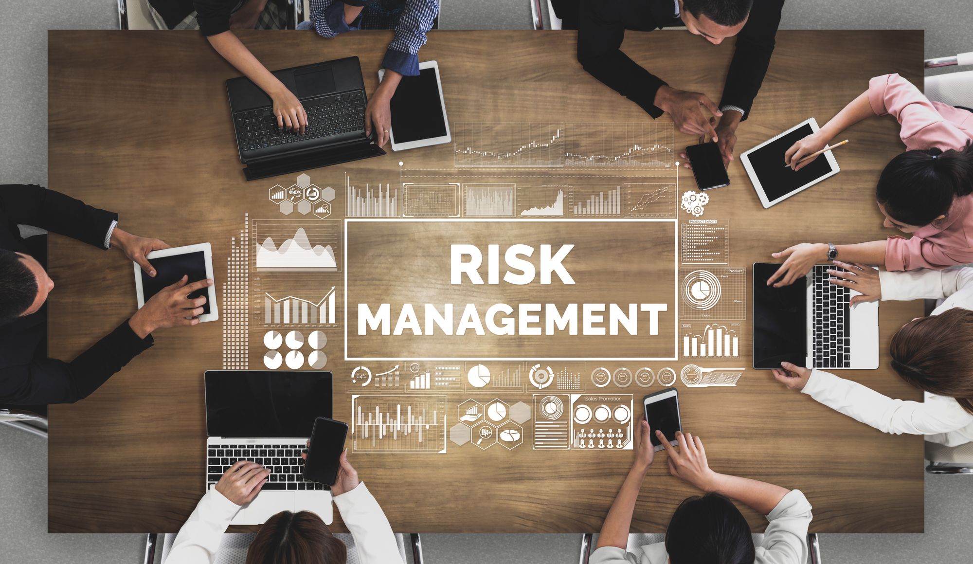 People sitting around a table discussing risk